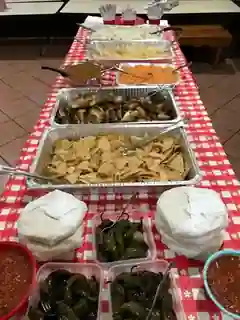 A long table filled with prepared food for a Door of Faith meal